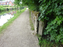 gatepost, canal towpath